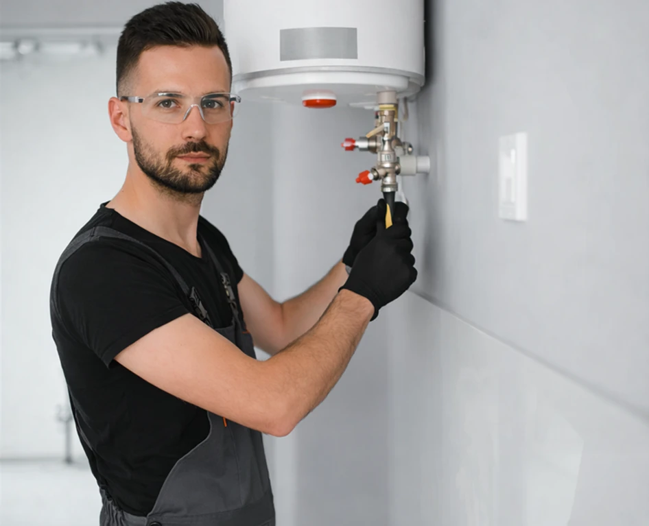Professional HVAC technician installing and servicing residential water heater system